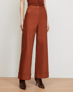 Veronica Beard Brown wide-leg trousers with cuffed hems.