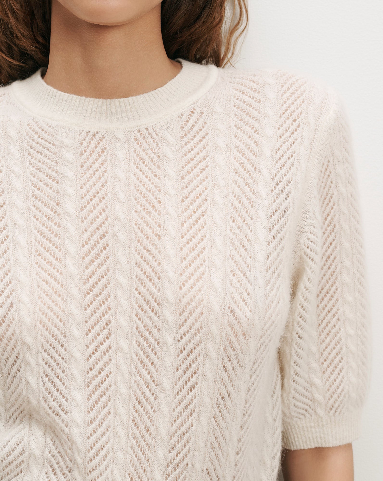 Veronica Beard White open-knit short-sleeve sweater with chevron pattern.