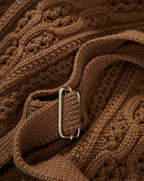 Veronica Beard Brown cable knit sweater with silver buckle.