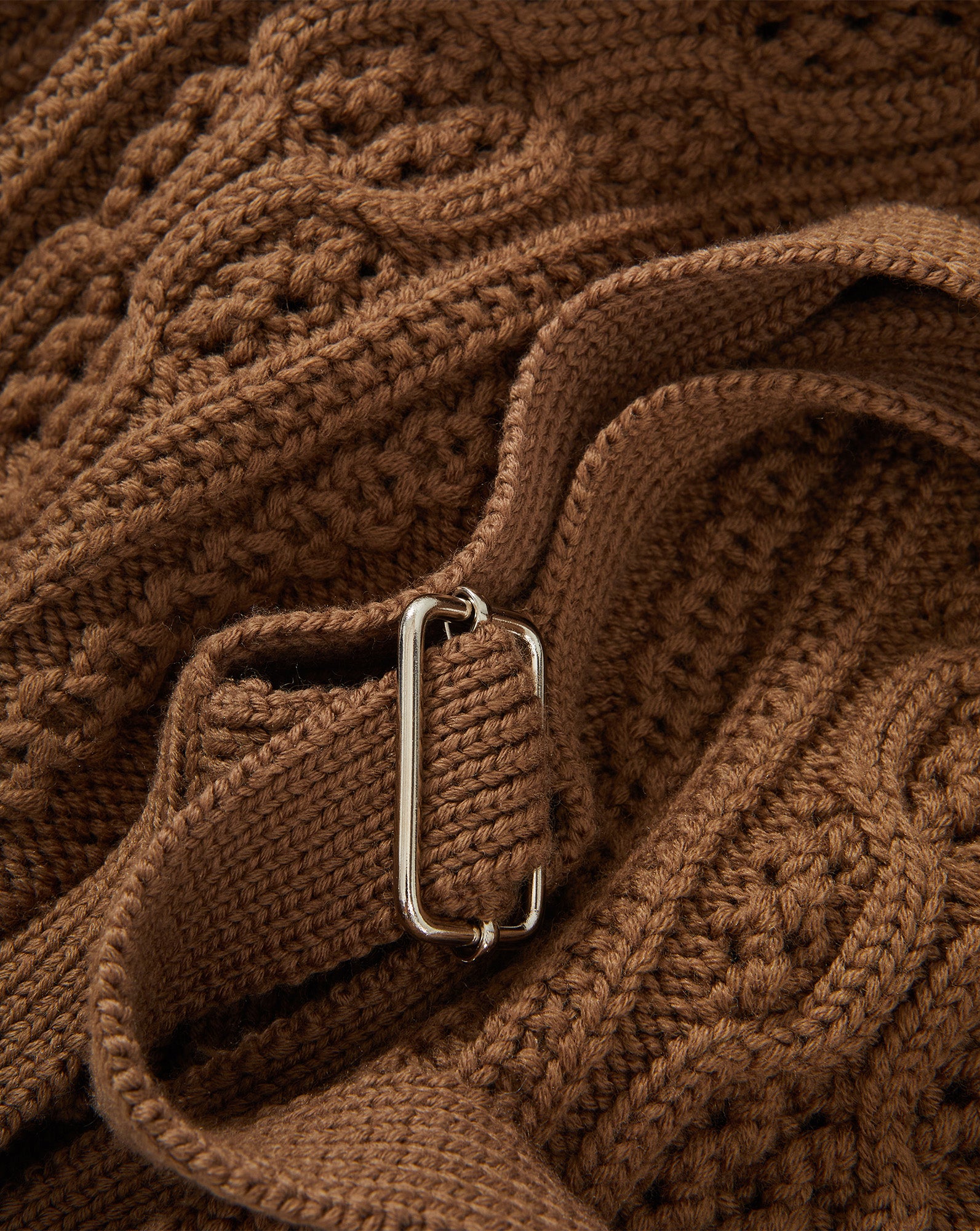 Veronica Beard Brown cable knit sweater with silver buckle.