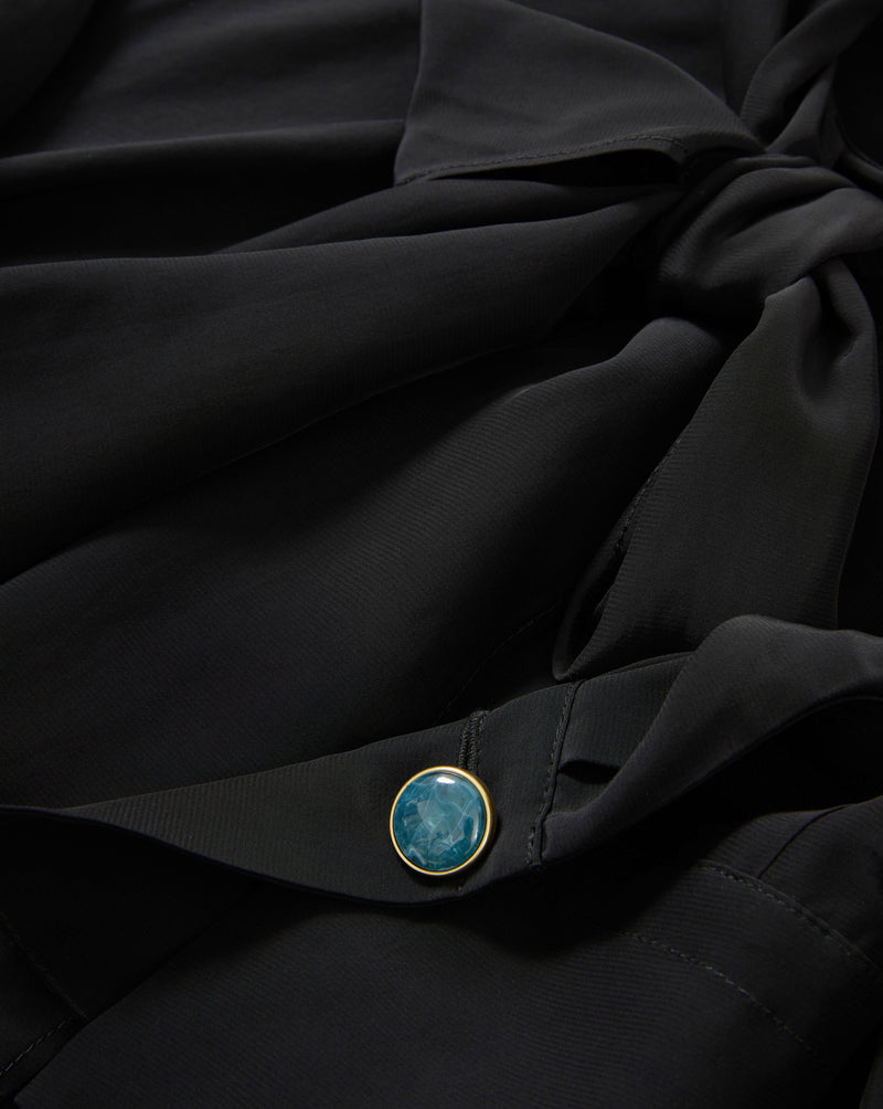 Veronica Beard Black silk blouse with teal button.