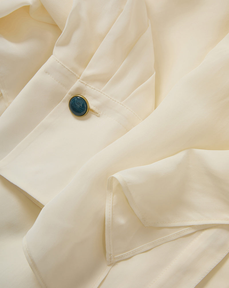 Veronica Beard Cream silk blouse, blue button cuff.