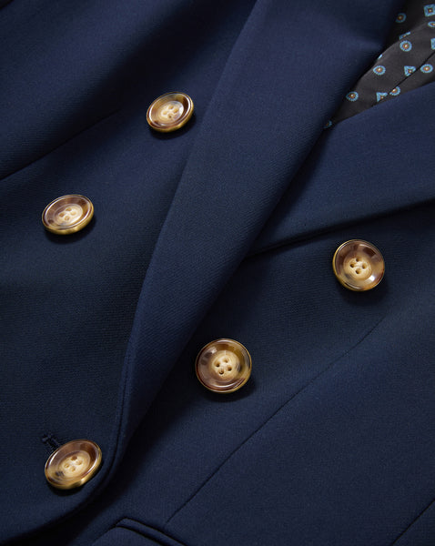 Veronica Beard Navy blue double-breasted blazer with tortoise shell buttons.