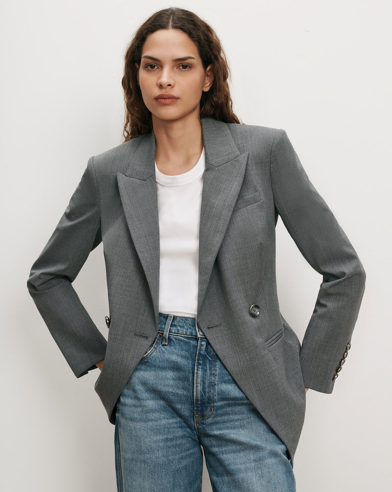 Veronica Beard Gray blazer, white t-shirt, blue jeans.