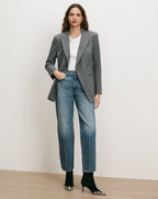 Veronica Beard Gray blazer, white tee, blue jeans, black boots.