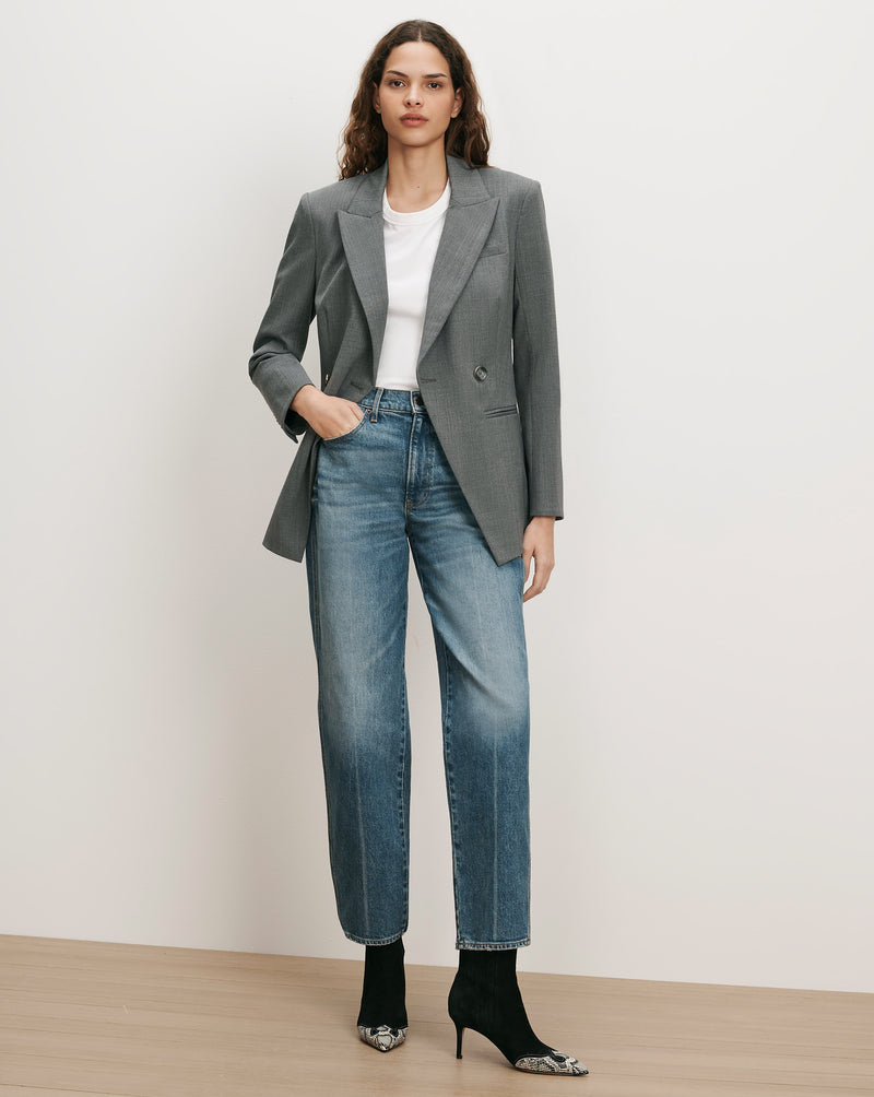 Veronica Beard Gray blazer, white tee, blue jeans, black boots.