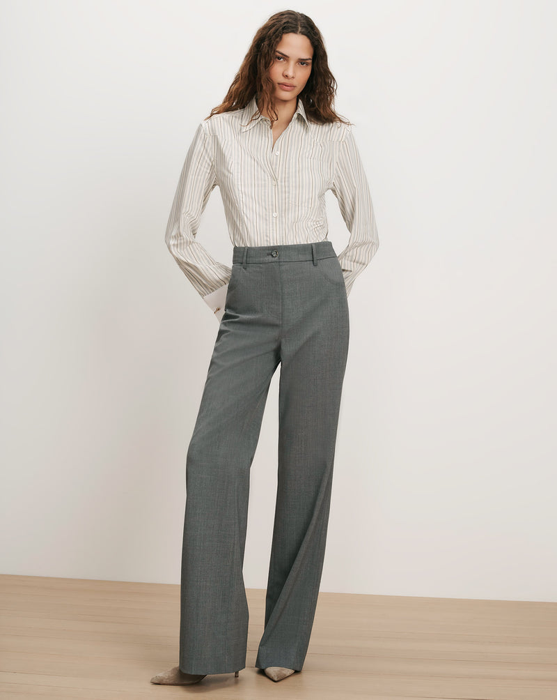 Veronica Beard Gray pinstripe shirt and gray wide-leg trousers.