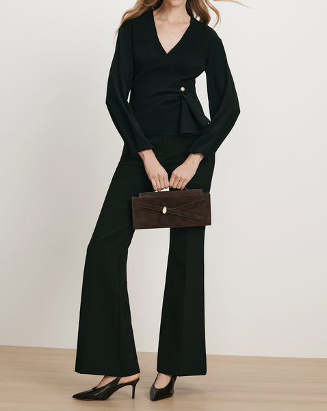Veronica Beard Black wrap blouse and flared trousers.