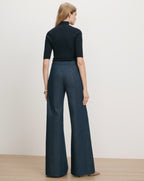 Veronica Beard Navy ribbed short-sleeve turtleneck and pinstripe wide-leg pants.