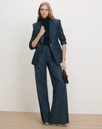 Veronica Beard Navy pinstripe suit with wide-leg pants and a fitted blazer.