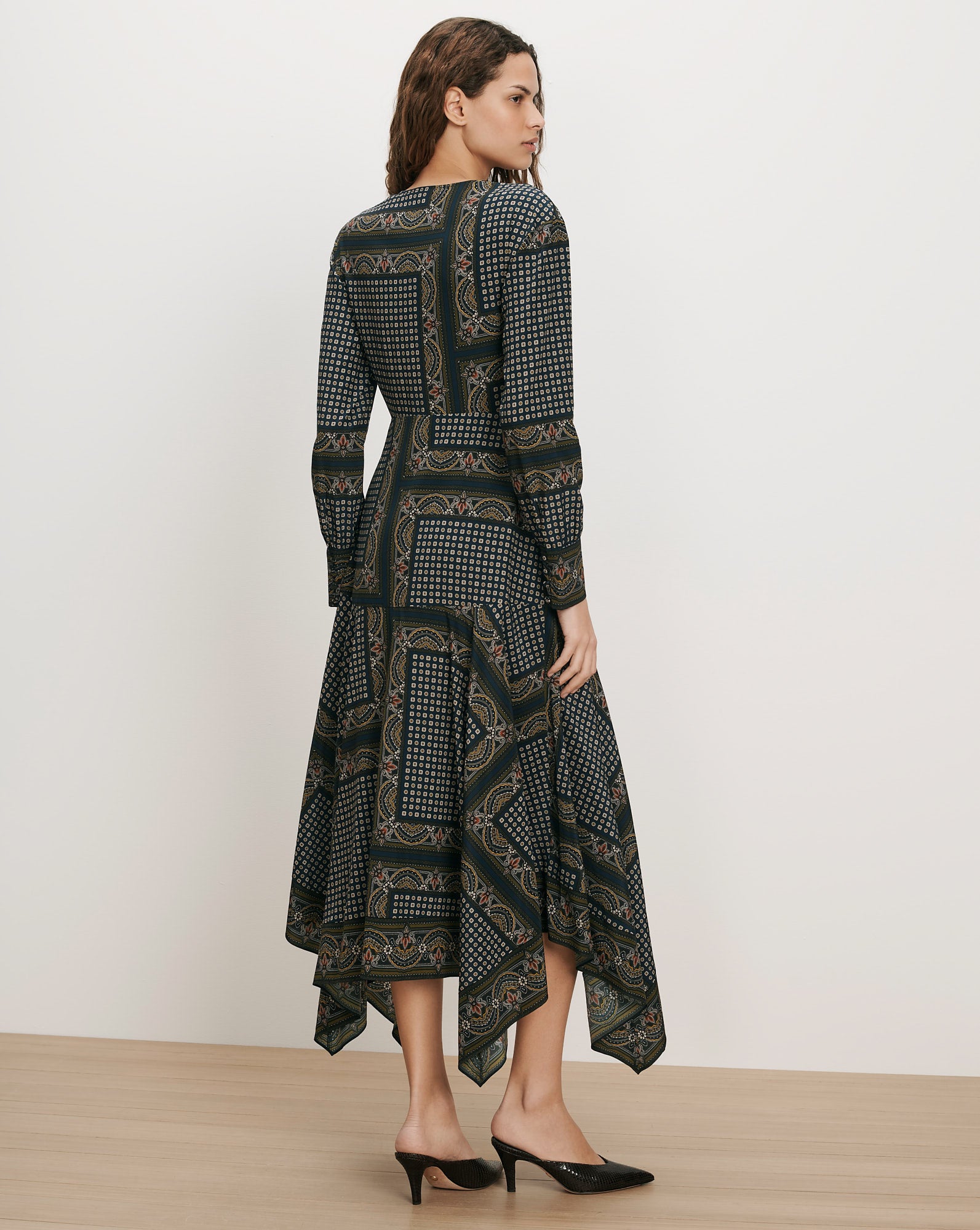 Veronica Beard Green patterned midi dress with long sleeves.