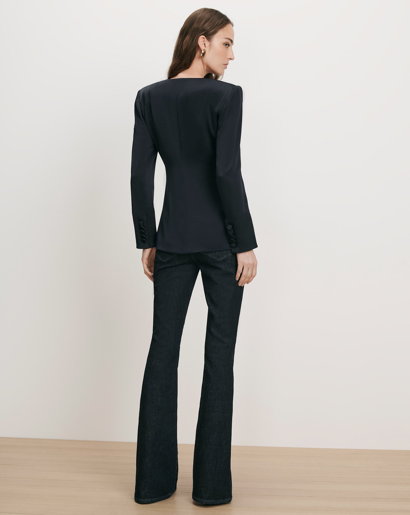 Veronica Beard Black blazer, dark wash flared jeans.