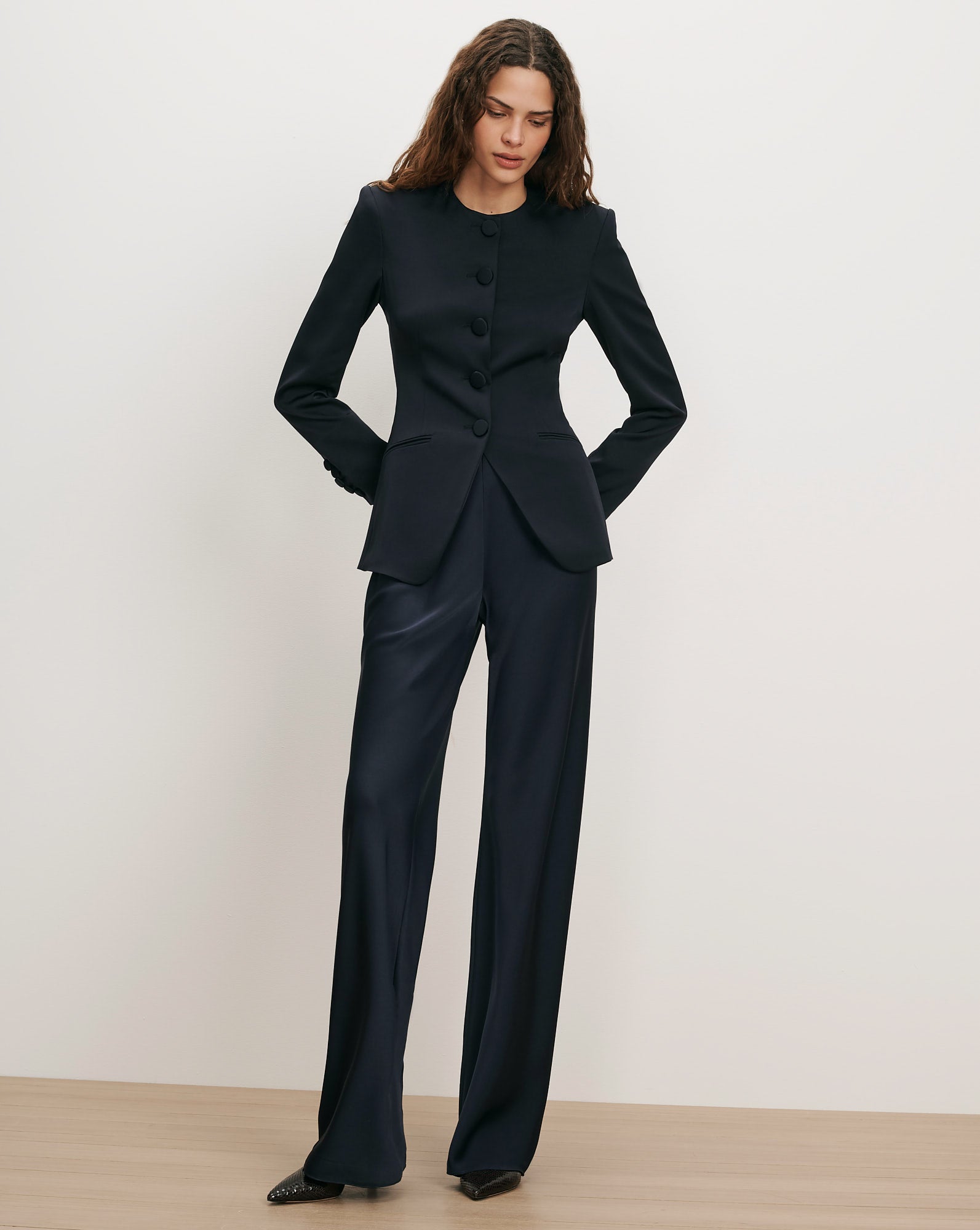 Veronica Beard Navy satin suit with button-front jacket and wide-leg pants.