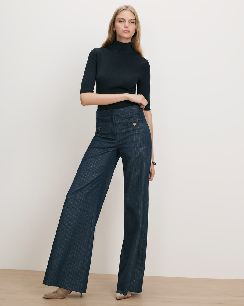 Veronica Beard Navy ribbed turtleneck and pinstripe wide-leg pants.