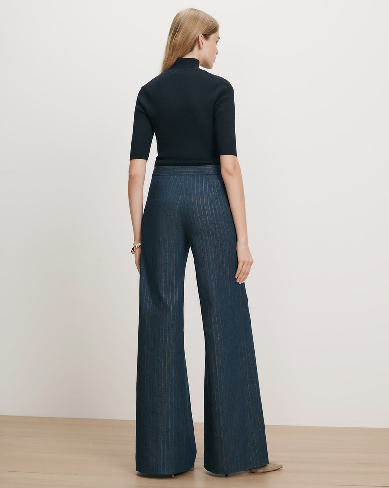 Veronica Beard Black short-sleeve turtleneck and wide-leg pinstripe pants.