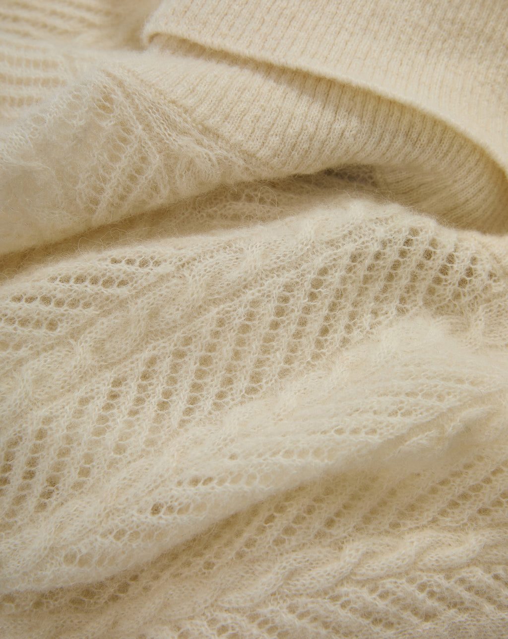 Veronica Beard Cream mohair sweater with open-knit pattern.