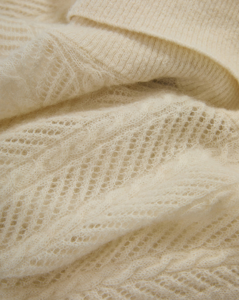 Veronica Beard Cream mohair sweater with open-knit pattern.