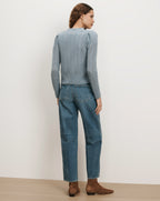 Veronica Beard Blue cable knit sweater, puff sleeves, and straight-leg jeans.