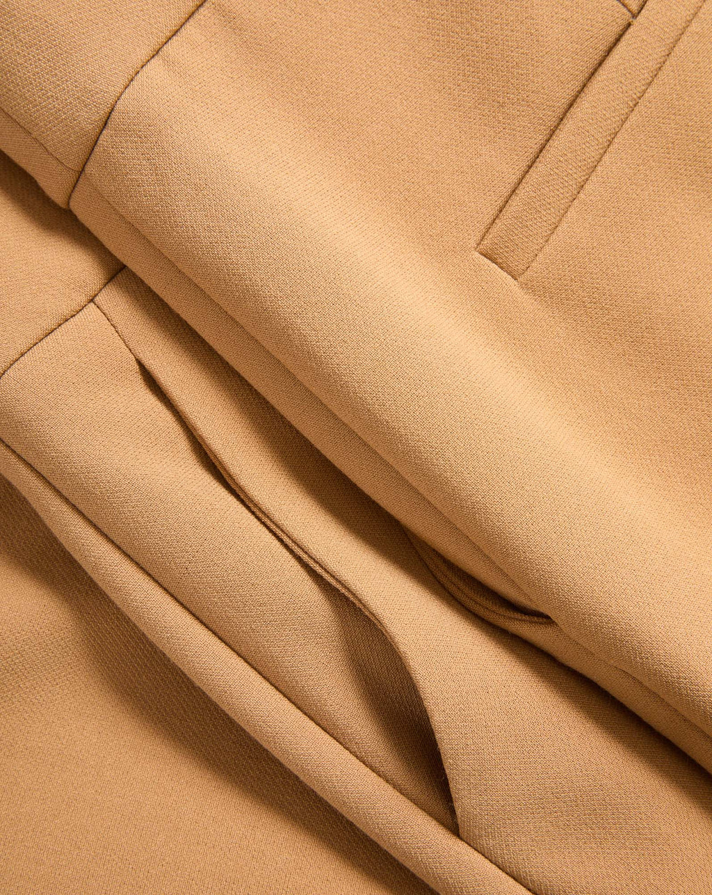 Veronica Beard Tan fabric trousers with a pleated waist.