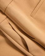 Veronica Beard Tan fabric trousers with a pleated waist.