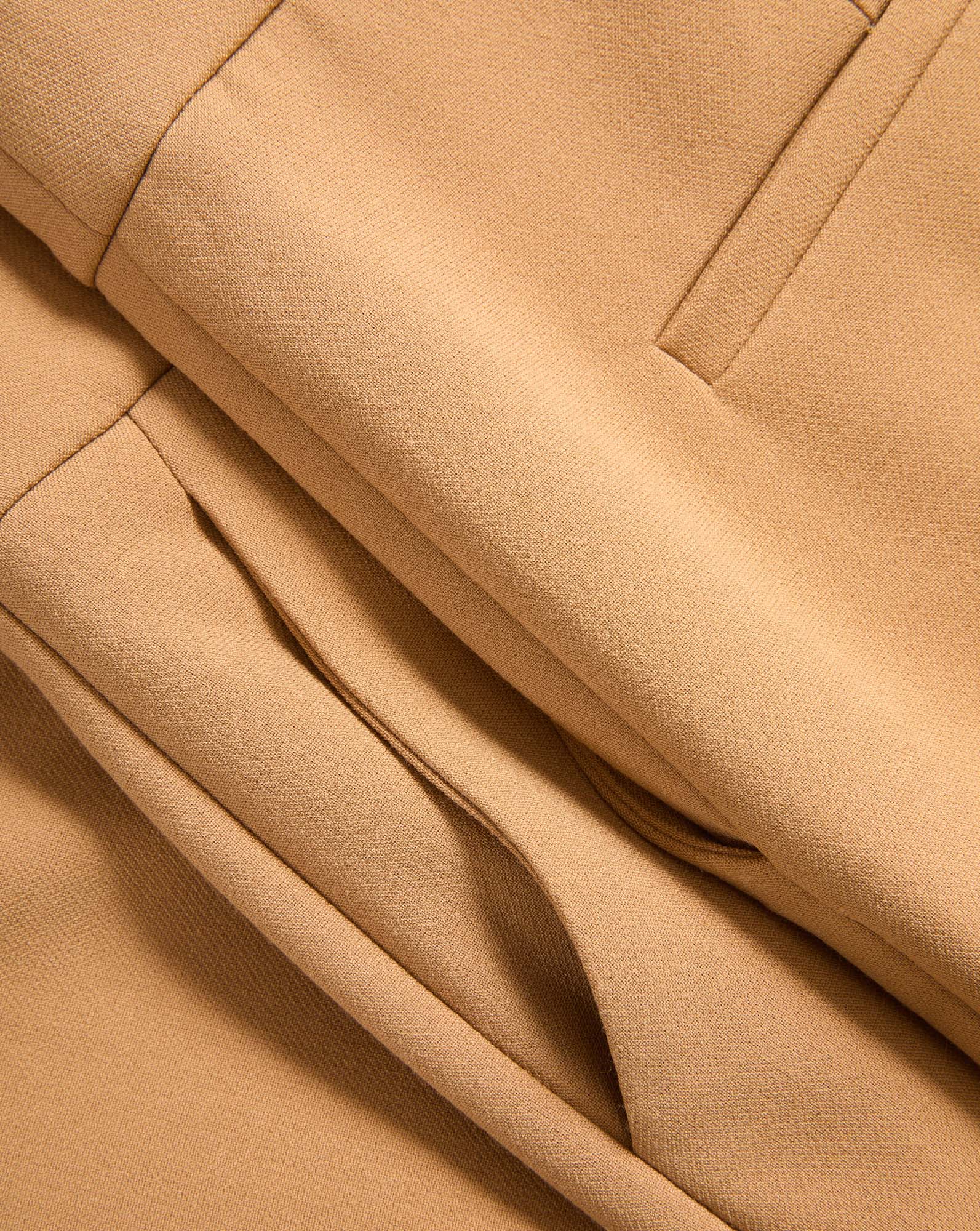 Veronica Beard Tan fabric trousers with a pleated waist.