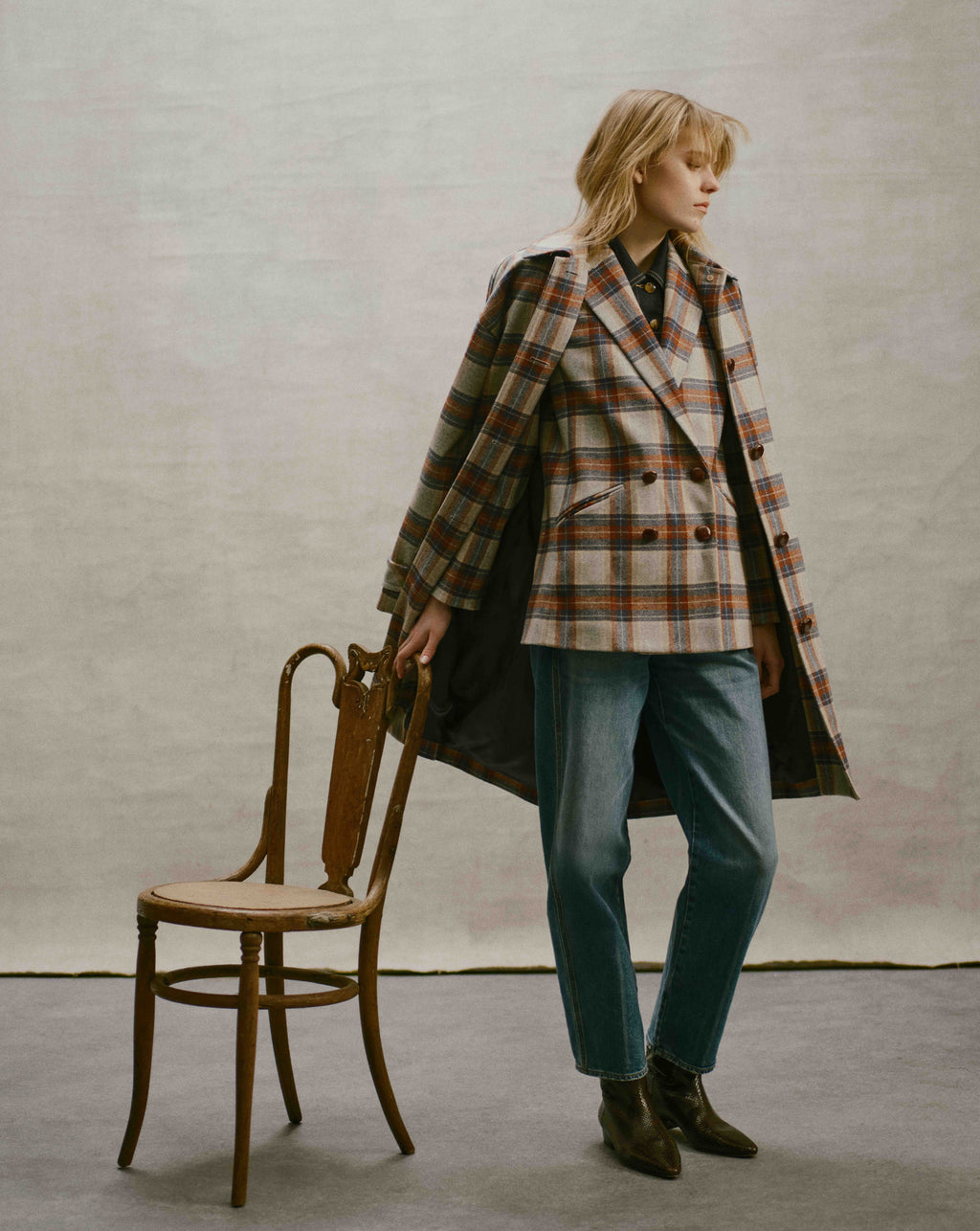 Veronica Beard Multicolor plaid double-breasted coat and blue jeans.