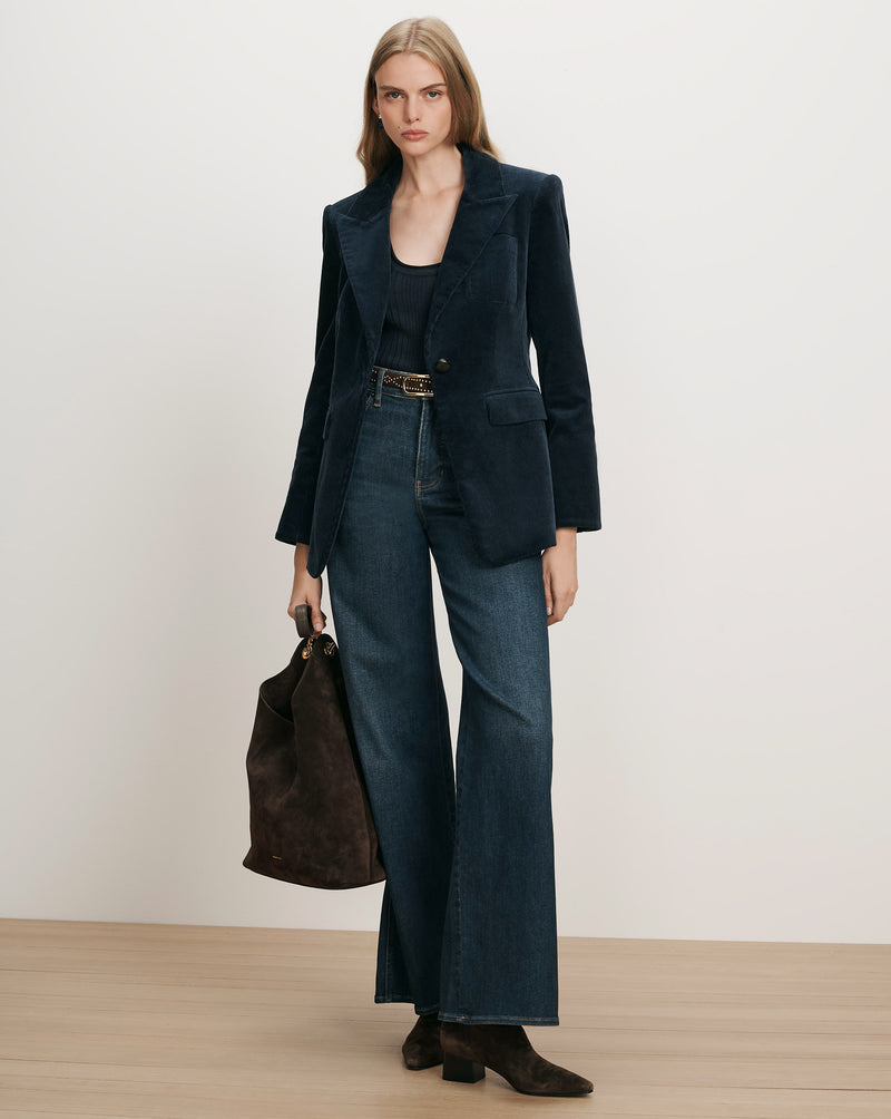 Veronica Beard Navy corduroy blazer, black tank top, wide-leg jeans.