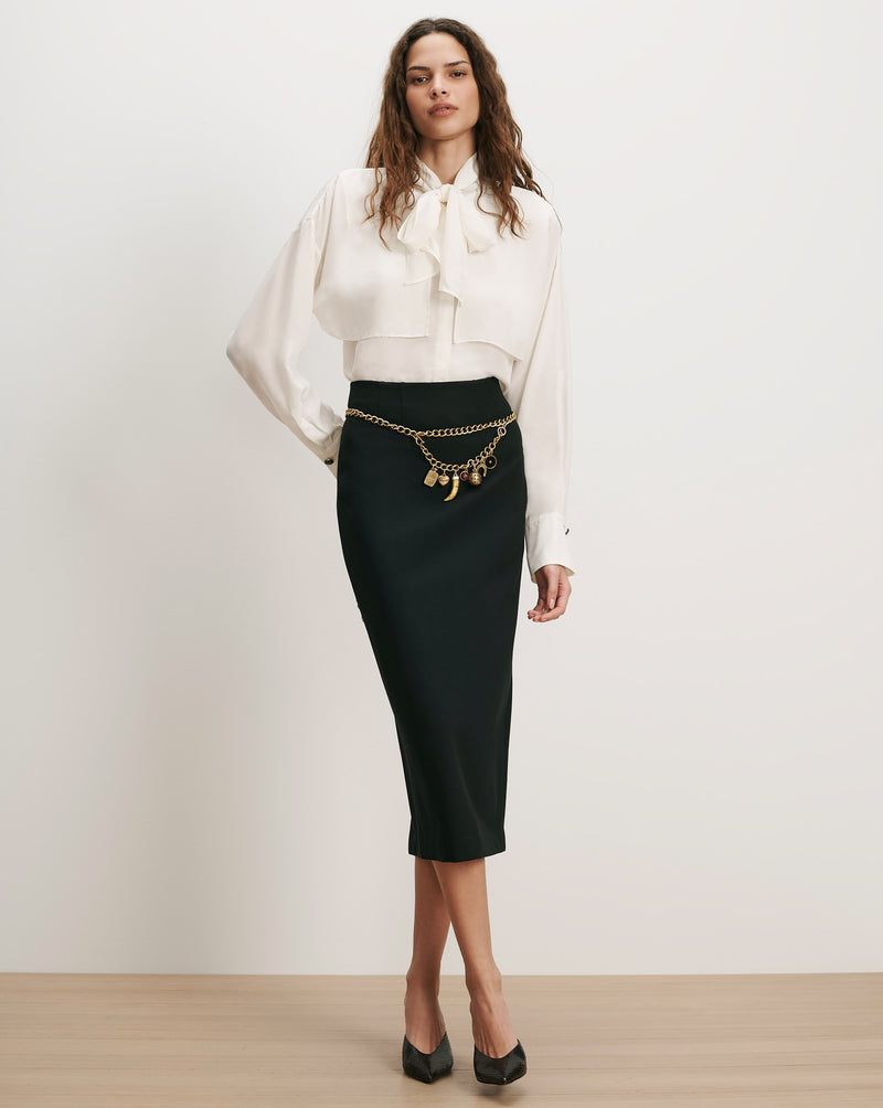 Veronica Beard White silk blouse, black pencil skirt, gold chain belt.