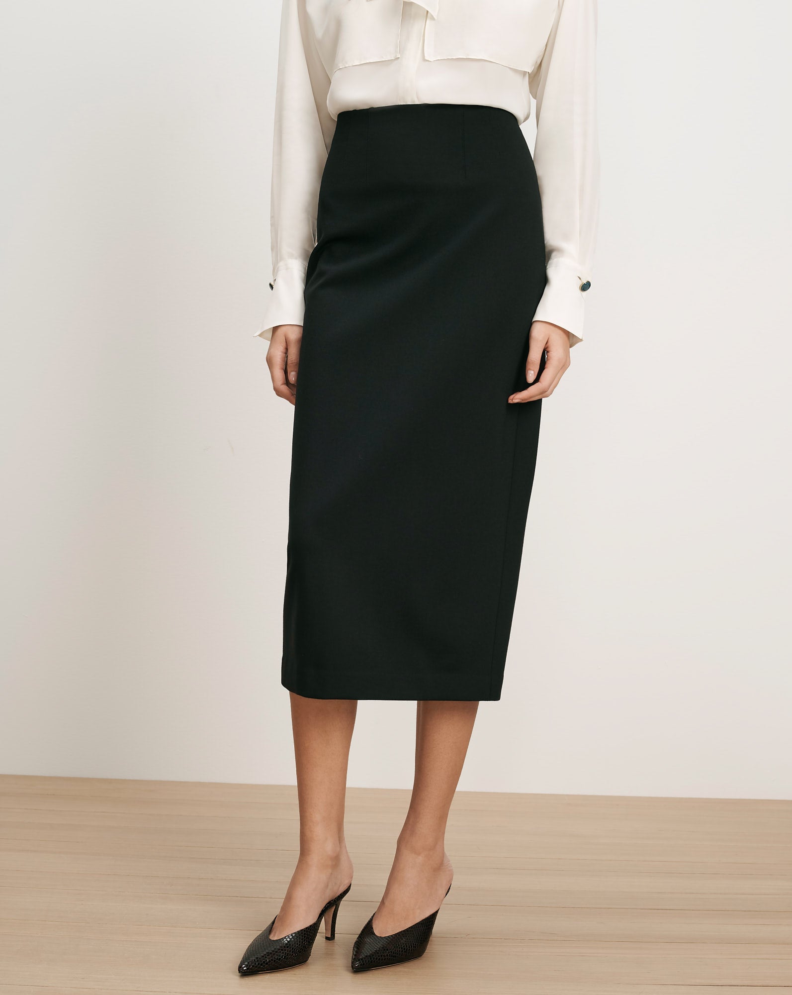 Veronica Beard Black pencil skirt, high-waisted, knee-length.
