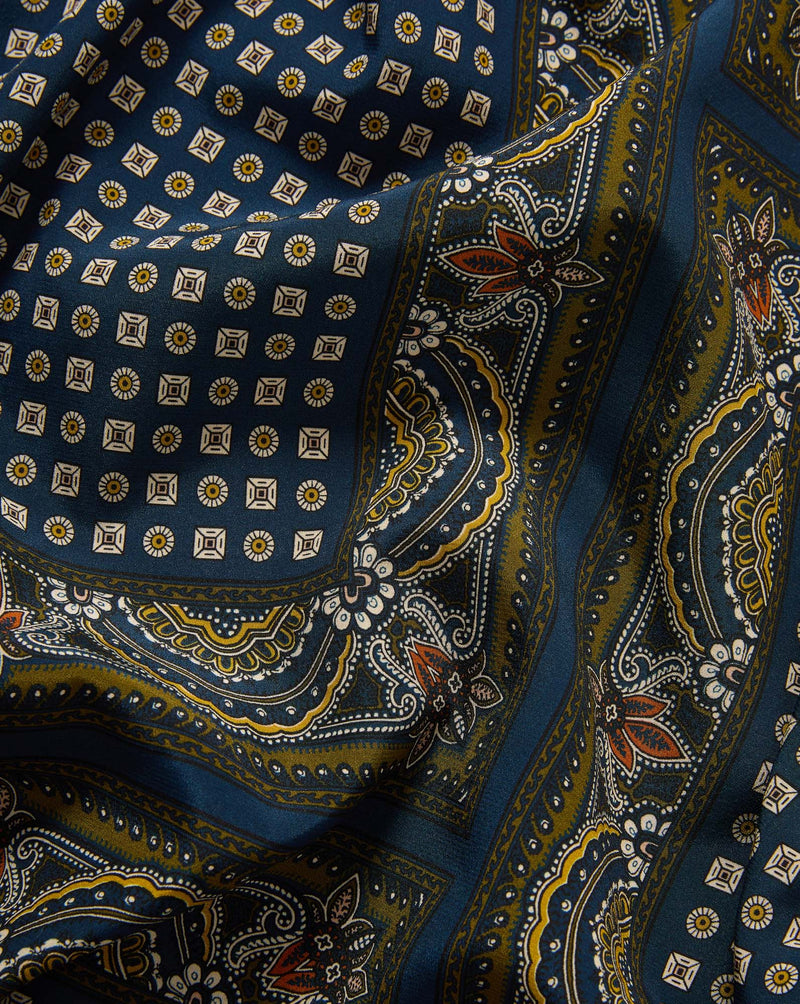 Veronica Beard Blue silk bandana with a yellow and white paisley pattern.