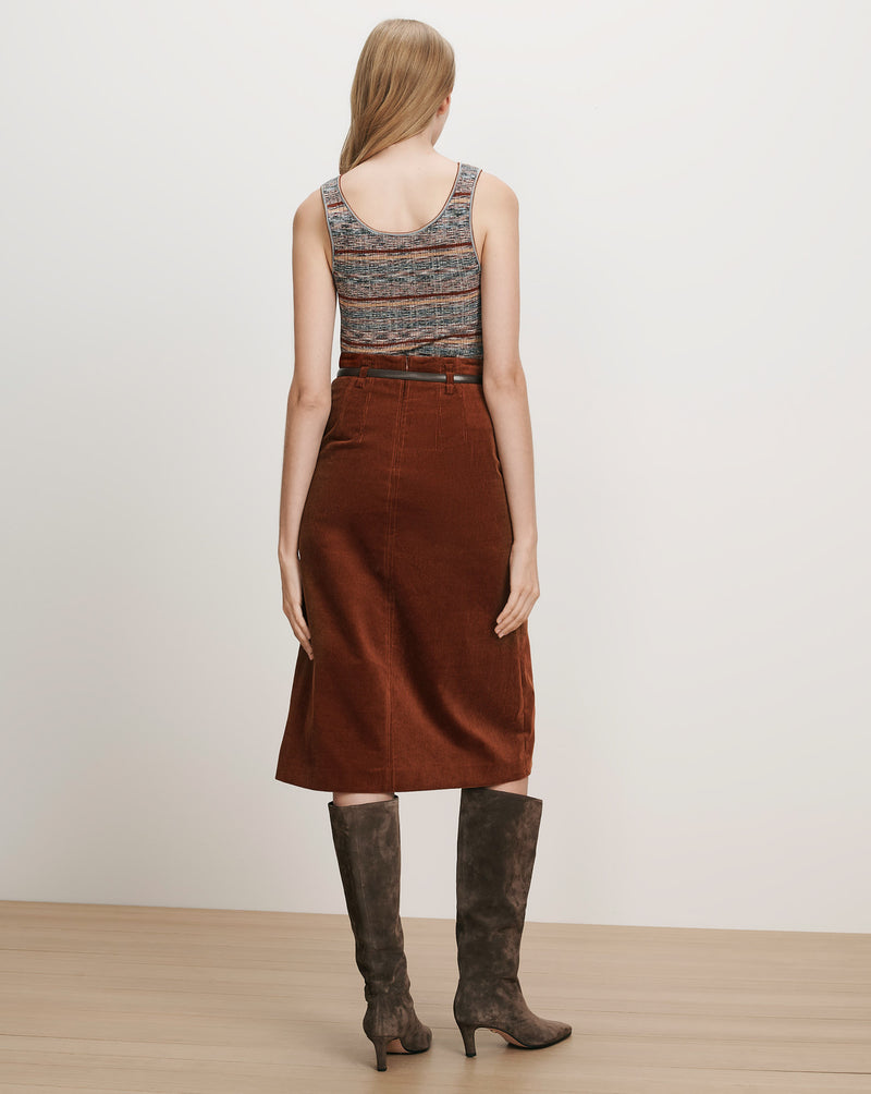 Veronica Beard Brown corduroy midi skirt, belted, with a striped tank top.