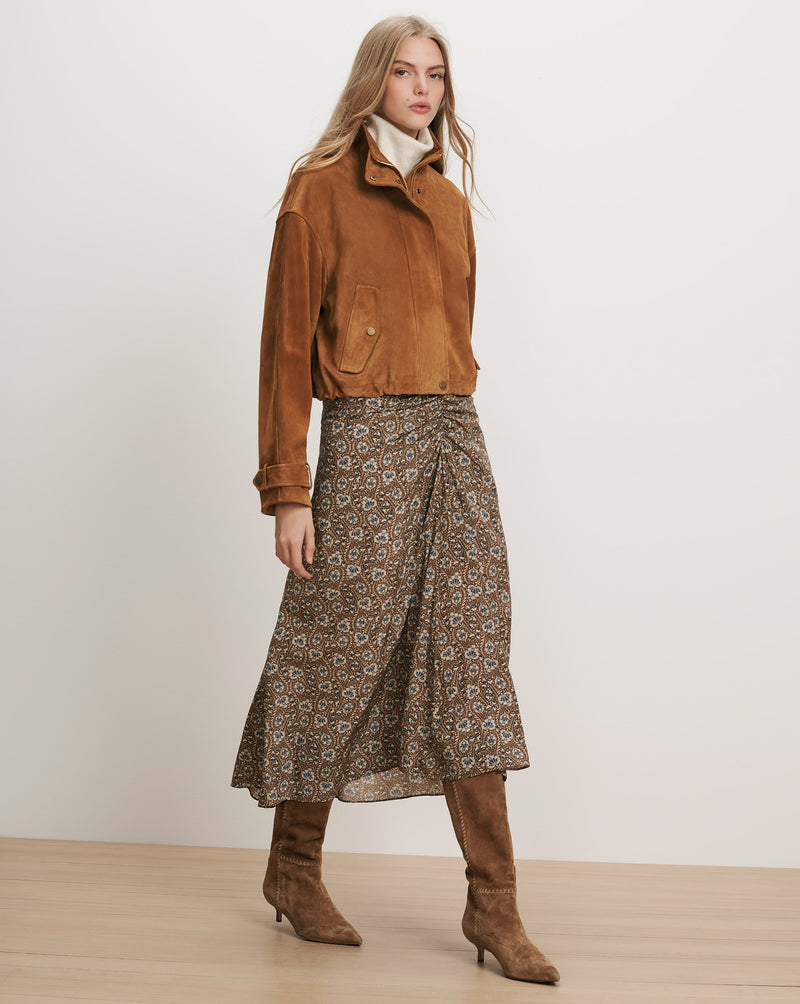 Veronica Beard Brown suede jacket, floral midi skirt, and brown boots.