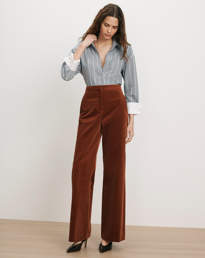 Veronica Beard Brown corduroy wide-leg pants and striped button-up shirt.