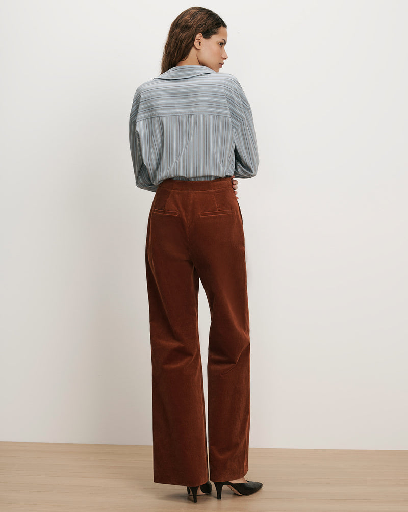 Veronica Beard Blue striped button-up shirt and brown corduroy wide-leg pants.