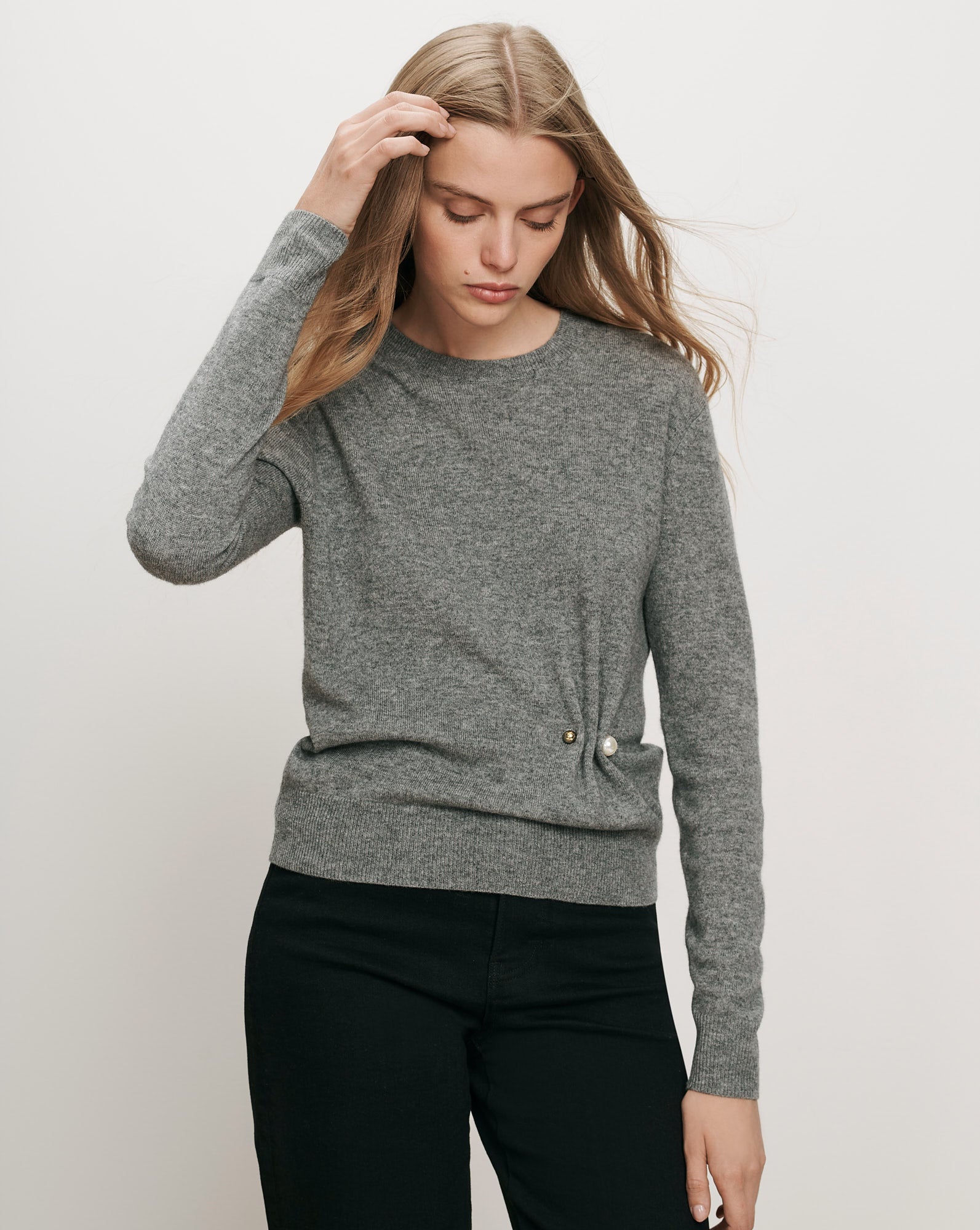 Veronica Beard Gray knit sweater with pearl button detail.