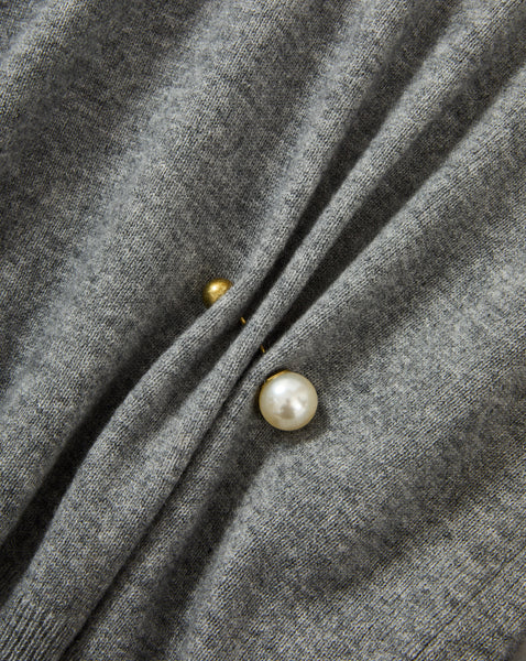 Veronica Beard Gray knit sweater with pearl and gold button details.