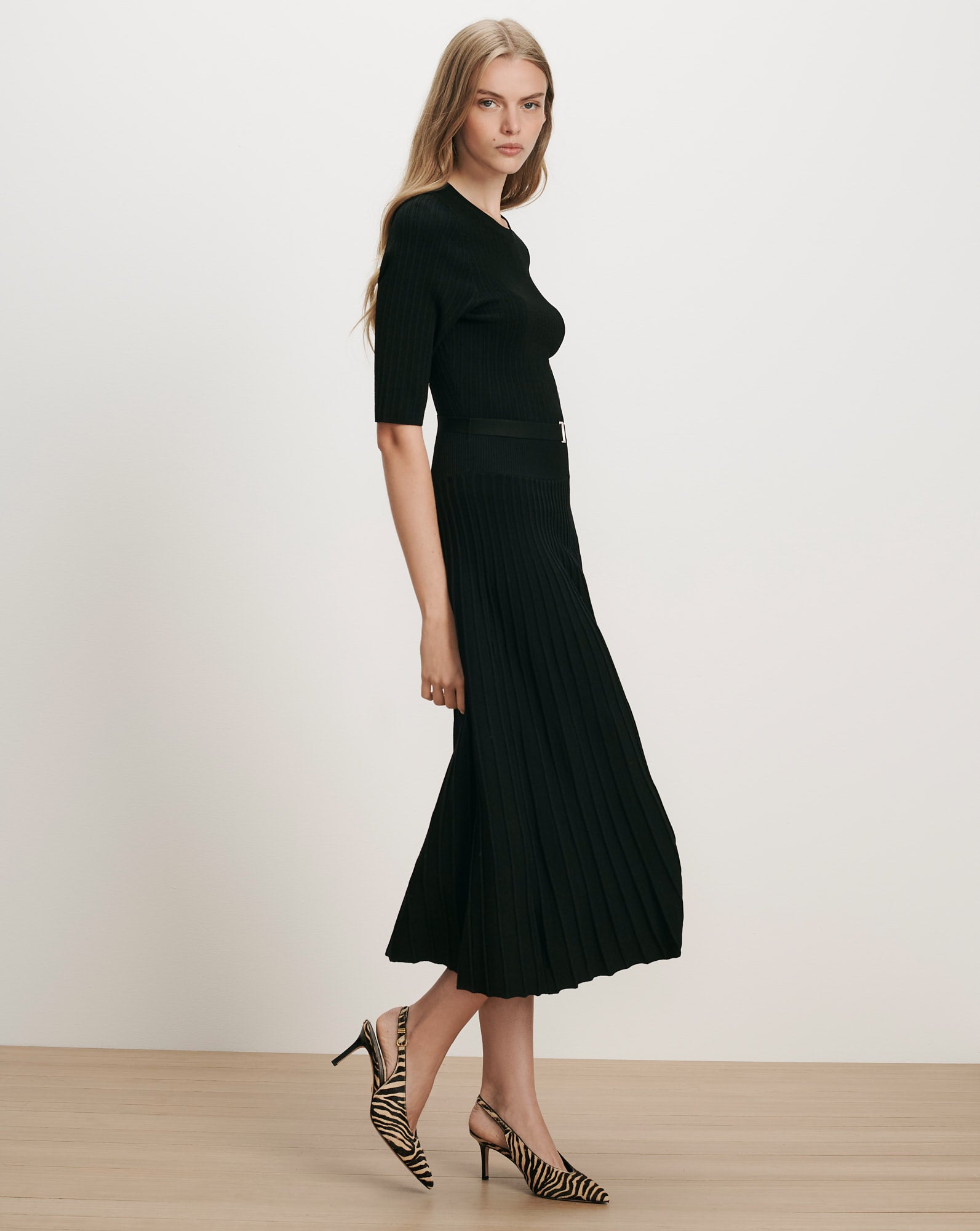 Veronica Beard Black ribbed knit midi dress with pleated skirt.
