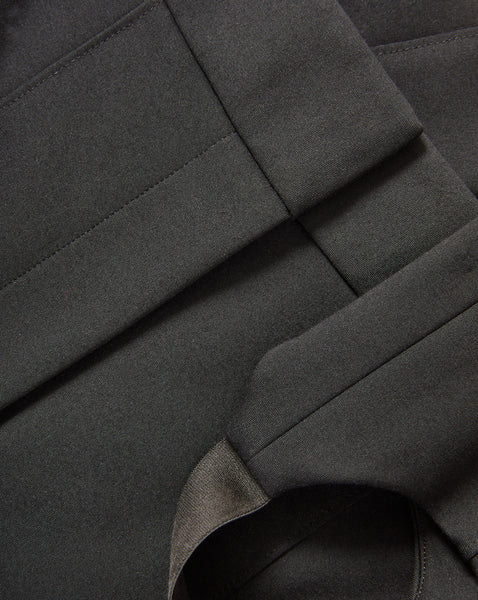 Veronica Beard Black woven fabric with pleats and seams.