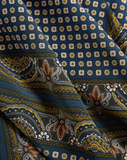 Veronica Beard Blue silk scarf with geometric and paisley patterns.