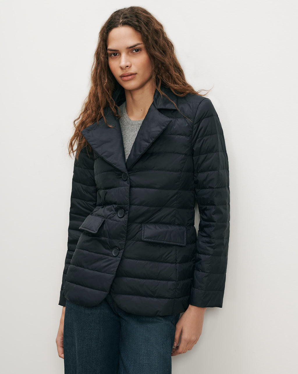 Veronica Beard Navy quilted blazer with notched lapels and flap pockets.