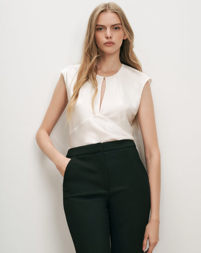 Veronica Beard White satin sleeveless blouse, black tailored trousers