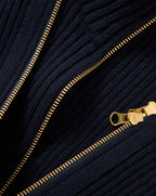 Veronica Beard Navy ribbed knit sweater with gold zipper.