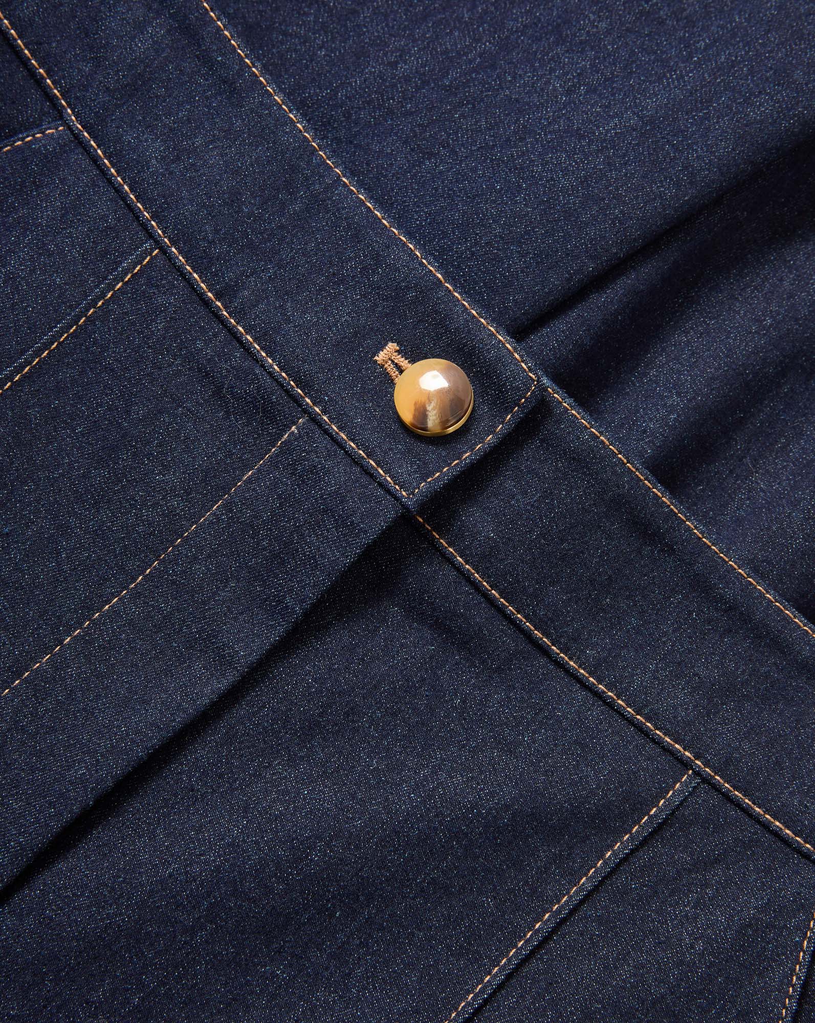 Veronica Beard Dark wash denim skirt with a single gold button.