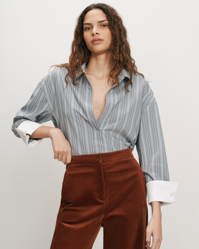 Veronica Beard Blue striped shirt with white cuffs.