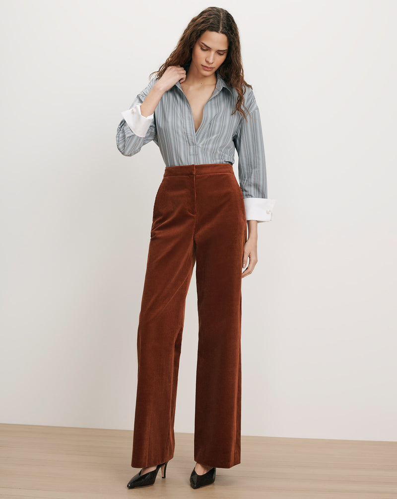 Veronica Beard Brown corduroy wide-leg pants and striped button-up shirt.