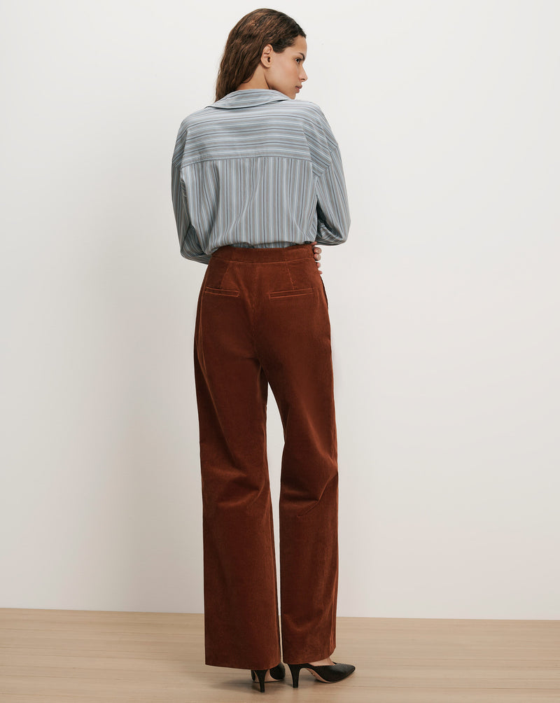 Veronica Beard Brown corduroy wide-leg pants and striped button-up shirt.