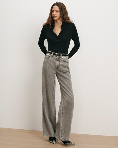 Veronica Beard Black ribbed knit polo shirt, gray wide-leg jeans