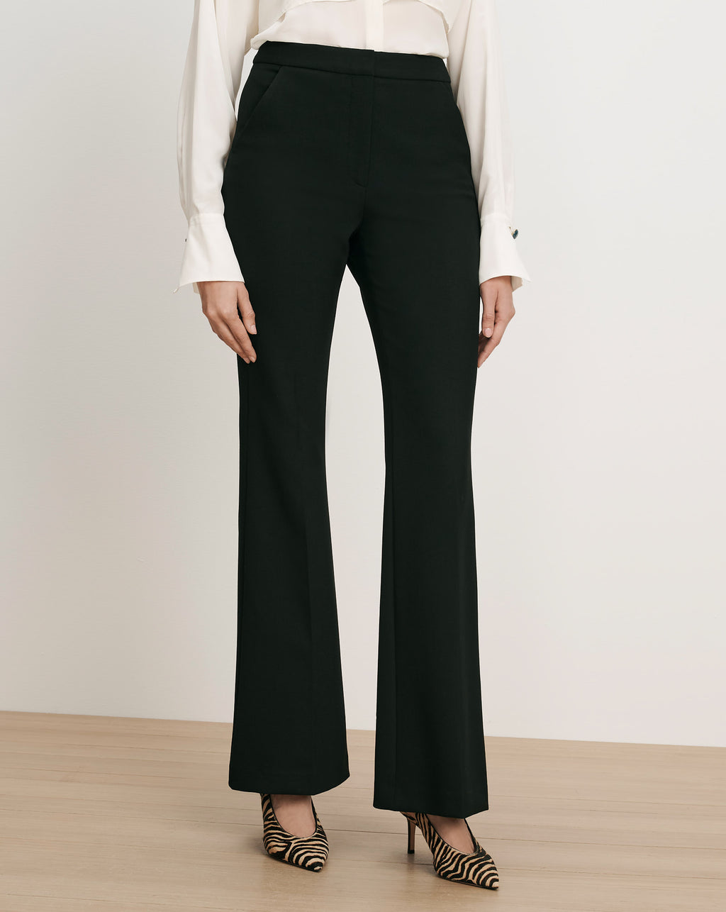 Veronica Beard Black flared trousers with a high waist.