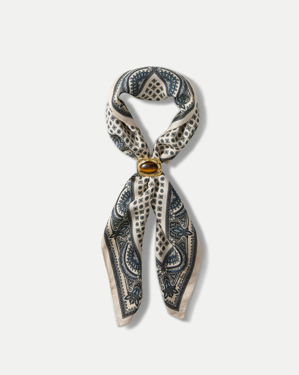 Veronica Beard Cream and blue patterned silk scarf with a brown stone ring.