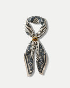 Veronica Beard Cream and blue patterned silk scarf with a brown stone ring.